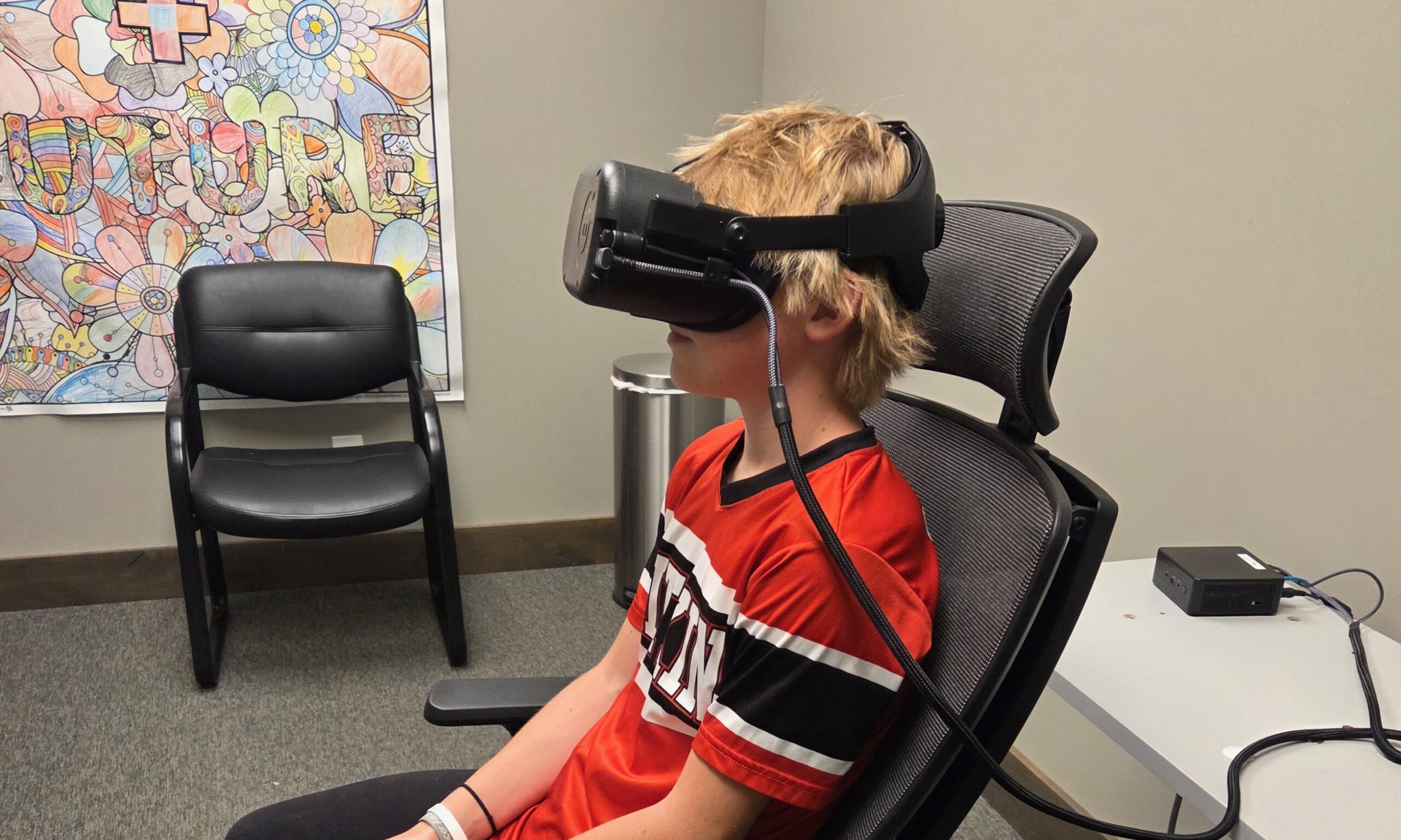 image of a boy seated with testing goggles on